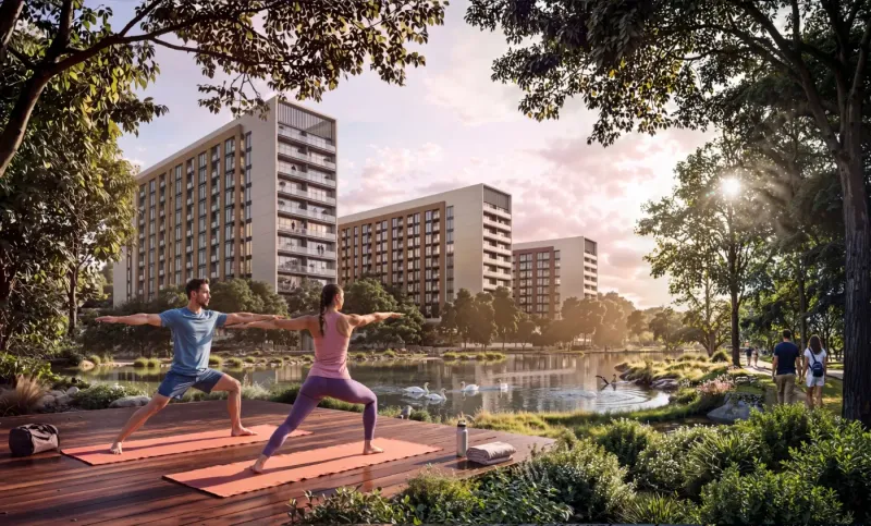 Render of a yoga deck beside the water at Sobha Sanctuary, with The Woods apartment towers behind.