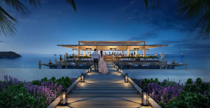 Render of a lit pier leading to a restaurant over the sea at dusk