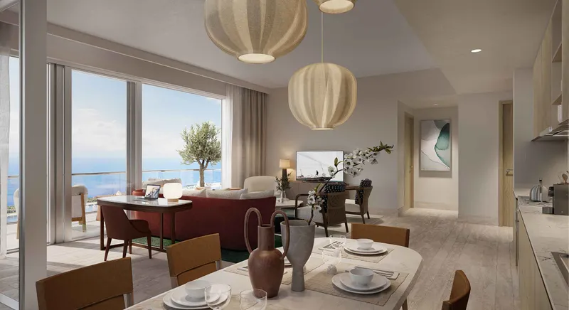 Render of an open-plan living and dining room with a kitchen and a balcony overlooking the sea