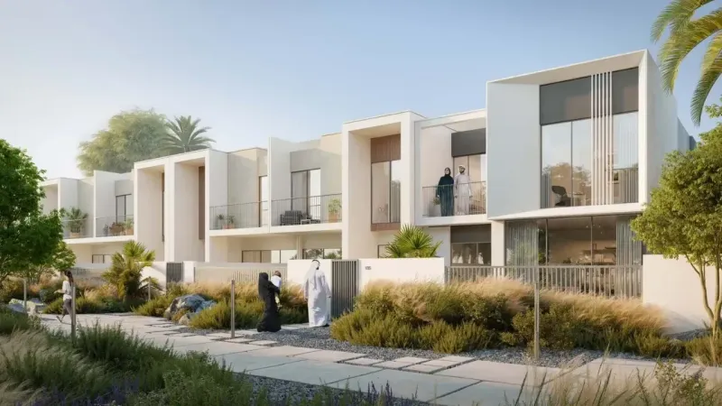 Alva at The Valley, townhouses on a landscaped street by Emaar
