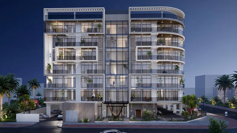 Night render of the front elevation of Arché Residence with glazed balconies and vertical fins