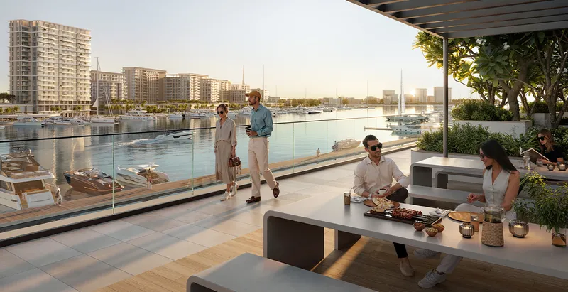 Render of residents dining on a covered terrace at Aurea above the marina
