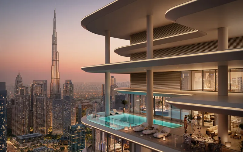 Render of the curved balconies of Avarra by Palace at dusk, with Burj Khalifa and the Downtown Dubai skyline behind