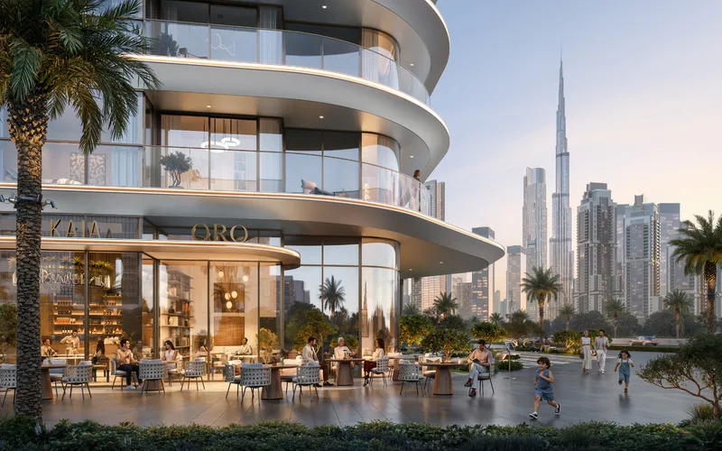 Render of a café terrace with outdoor seating at the base of Avarra by Palace, with Burj Khalifa in the distance