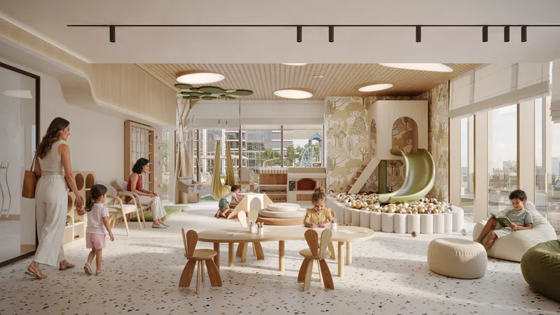 Indoor kids’ play area with a slide at Avenue Park Towers II