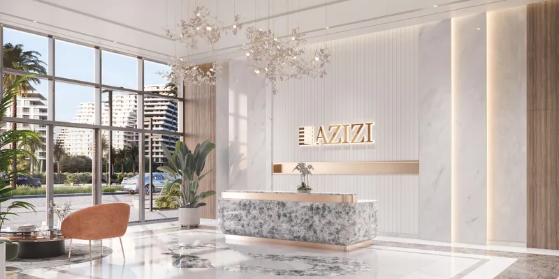 Marble lobby with a reception desk and chandeliers at Azizi Venice
