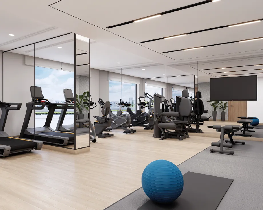 Residents' gym with treadmills and weight machines at Azizi Wasel