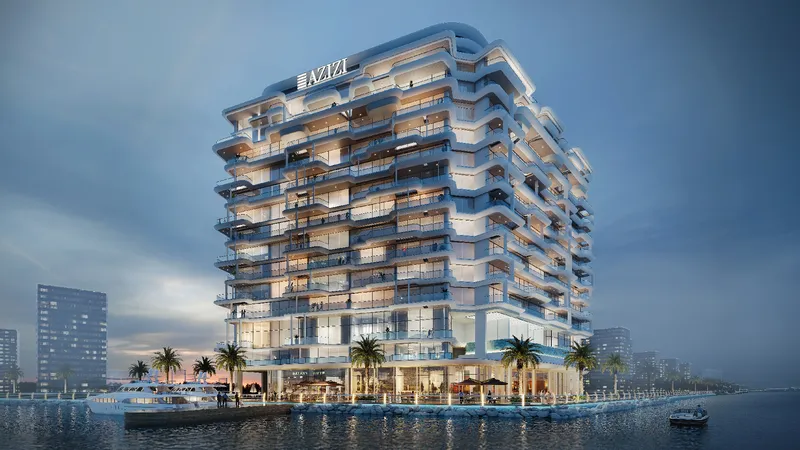 Render of the Azizi Wasel tower on the Dubai Islands waterfront at dusk, with yachts moored alongside