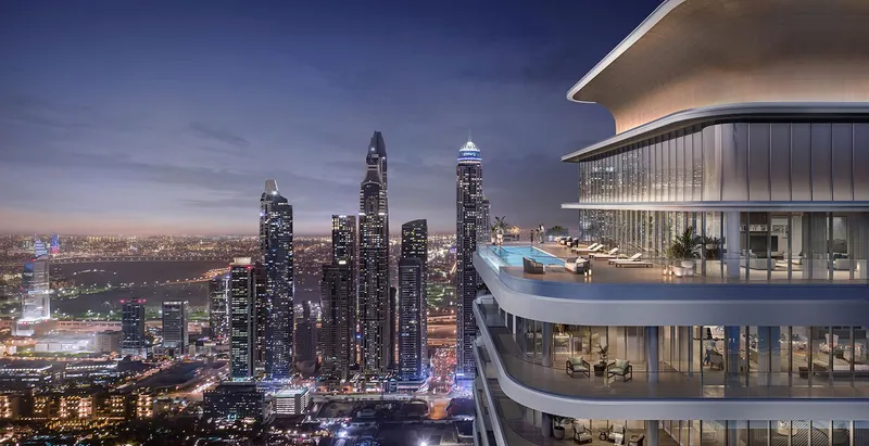 Render of a Bayview penthouse terrace with a private pool and the Dubai Marina skyline at night