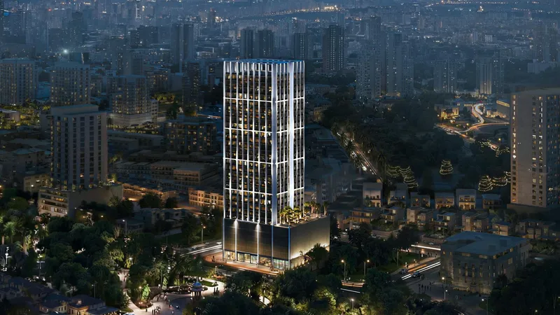 Aerial render of Binghatti Etherea lit up at night in Jumeirah Village Circle