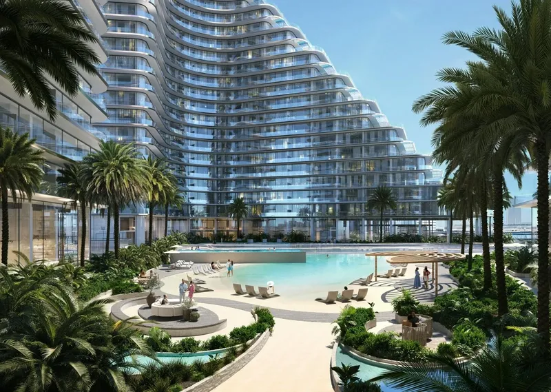Render of the Binghatti Flare pool deck with loungers and palms beneath the curved balconies