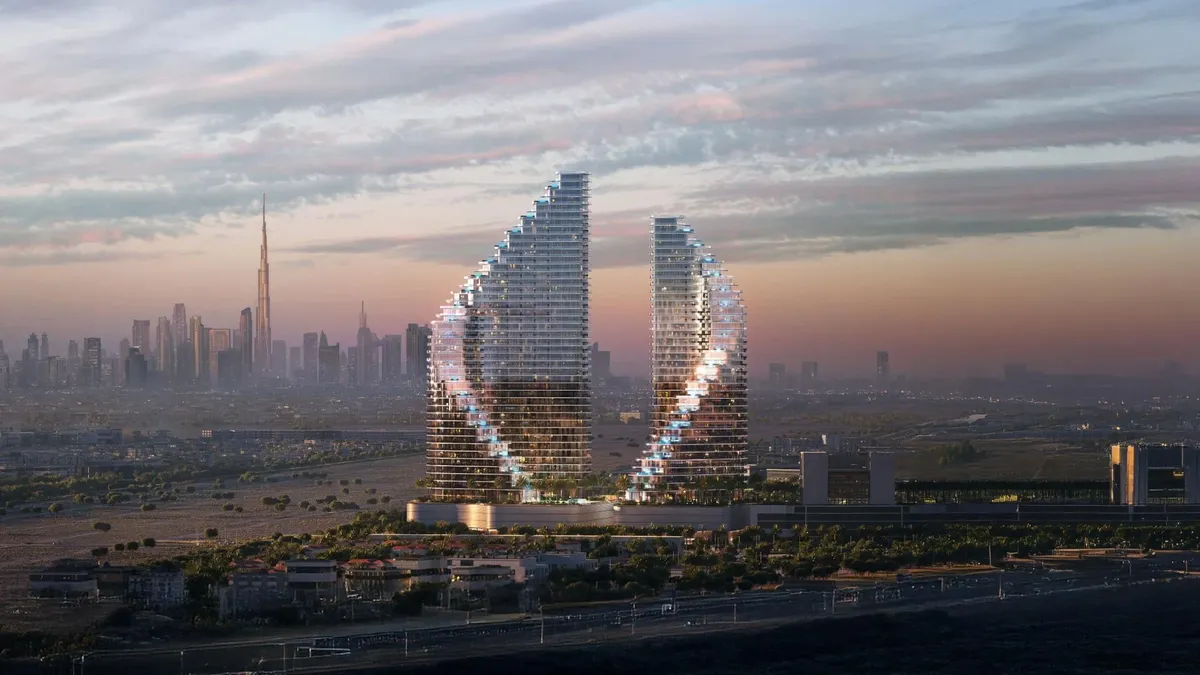 Computer-generated render of the two curved Binghatti Flare towers in Jumeirah Village Triangle at dusk, with the Dubai skyline behind