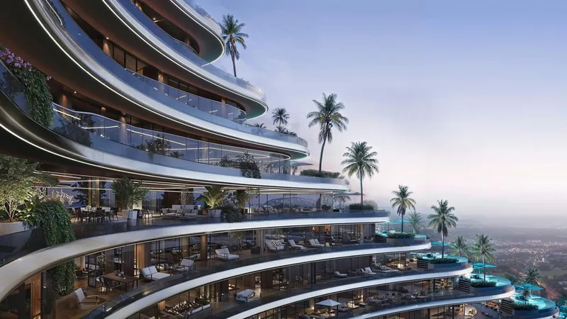 Curved balconies wrapping the Binghatti Skyflame facade, with palms and the city beyond
