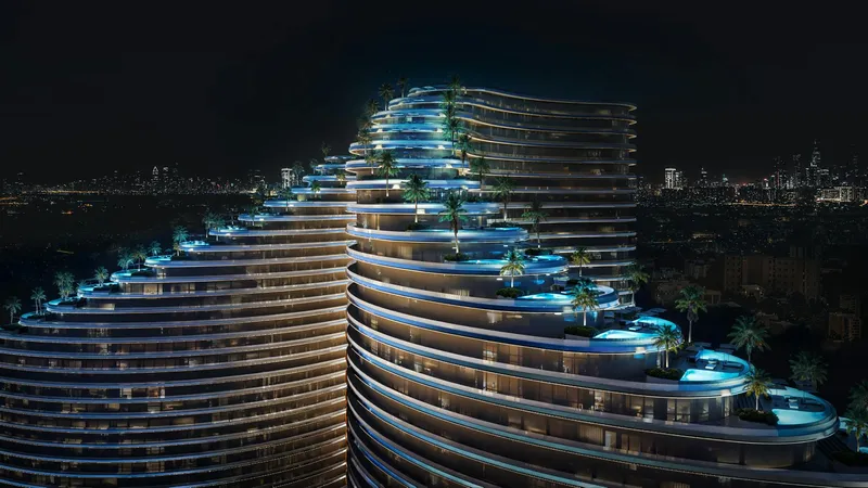 Stepped, curved Binghatti Skyflame facade lit at night