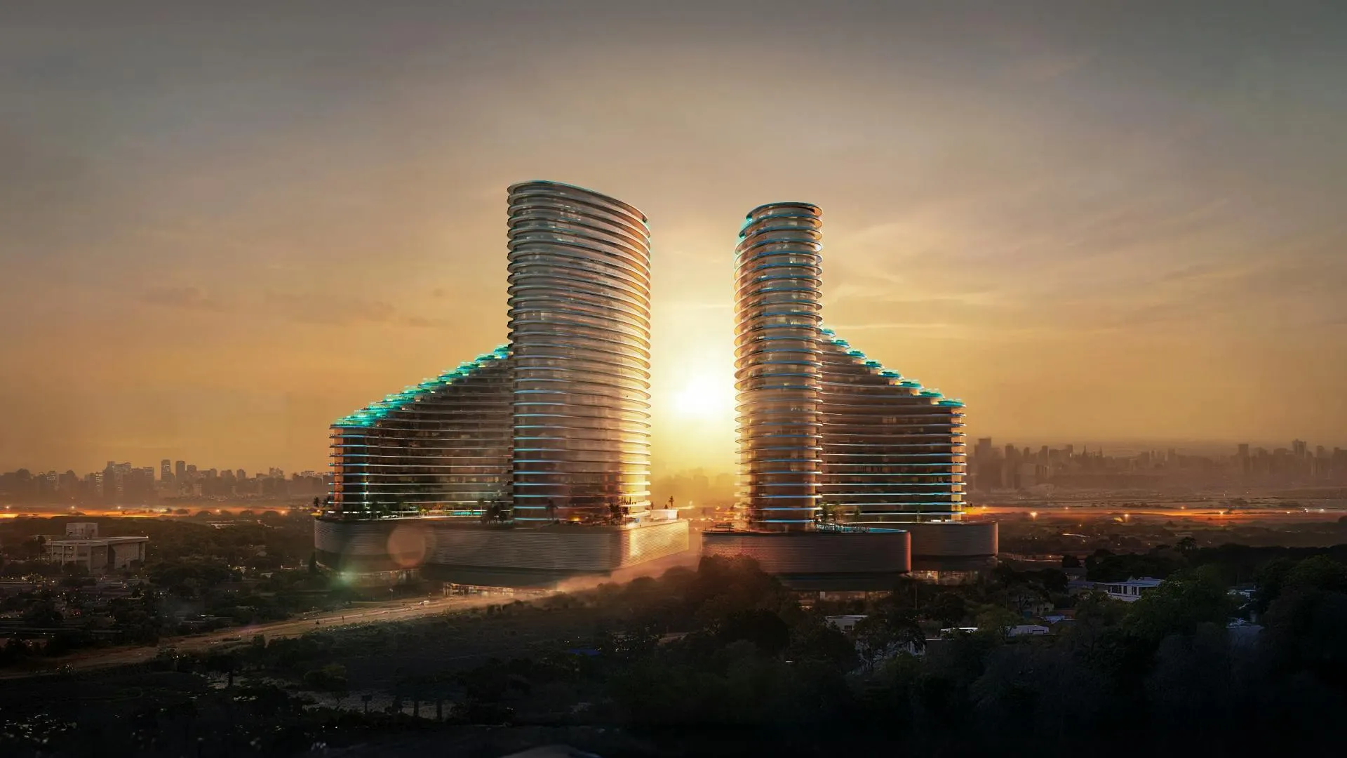 The two Binghatti Skyflame towers in Majan at sunset