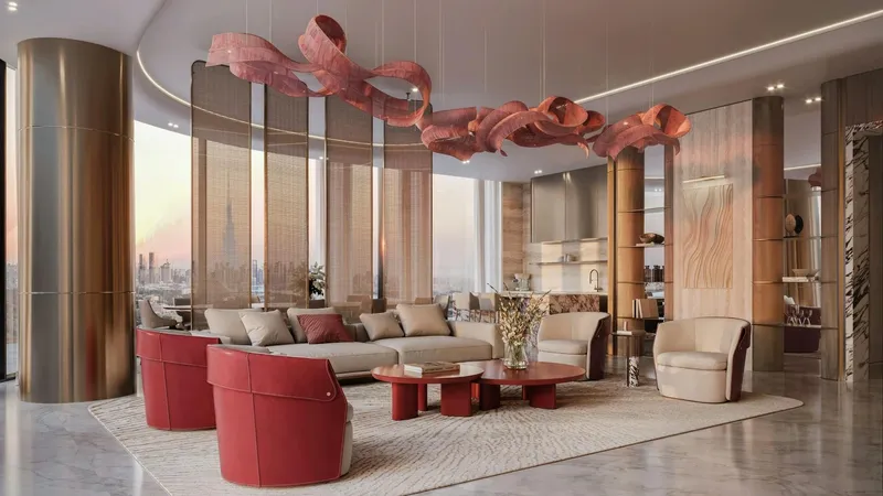 Render of a living room at Binghatti Skyblade with red armchairs and floor-to-ceiling windows