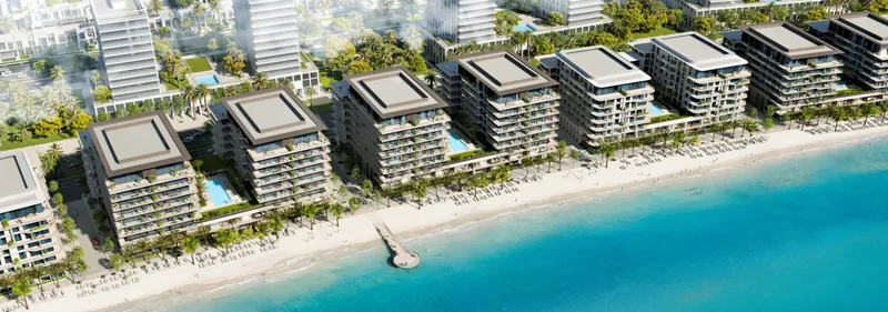 Blue Beach Residence buildings along the beach at Ajmal Makan City, aerial view