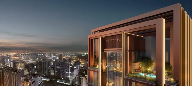Framed crown of Burj Capital with planted terraces above the city at dusk