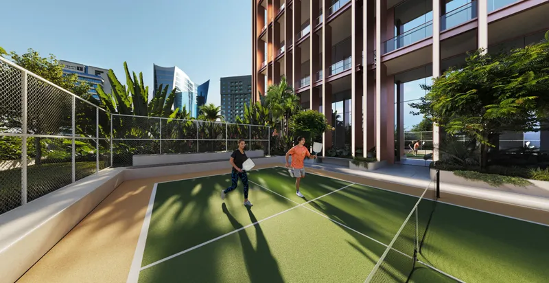 Outdoor pickleball court beside the Burj Capital tower