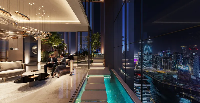 Skyline lounge at Burj Capital with sofas, a water feature and night views of the city