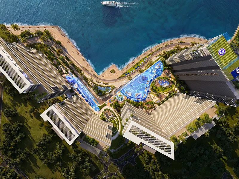 Aerial render of the Chelsea Residences podium, pools and towers on the Dubai Maritime City shoreline