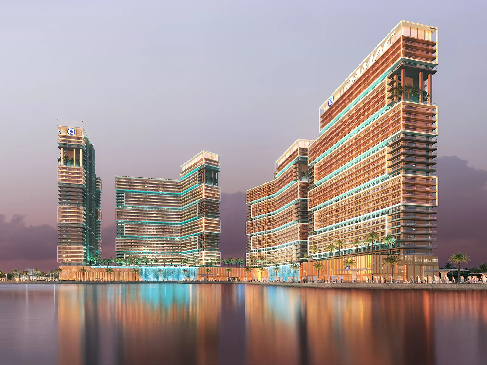 Chelsea Residences towers by DAMAC reflected in the water of Dubai Maritime City at dusk