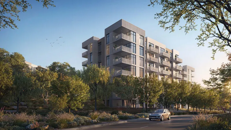 Cilia apartment block seen from a tree-lined street at Ghaf Woods