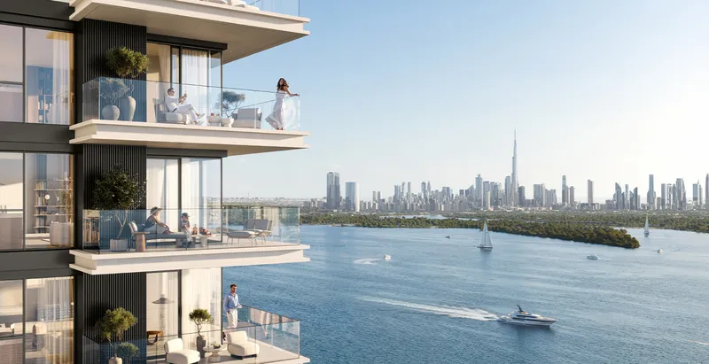 Render of Creek Bay balconies looking across Dubai Creek to the Downtown Dubai skyline and Burj Khalifa