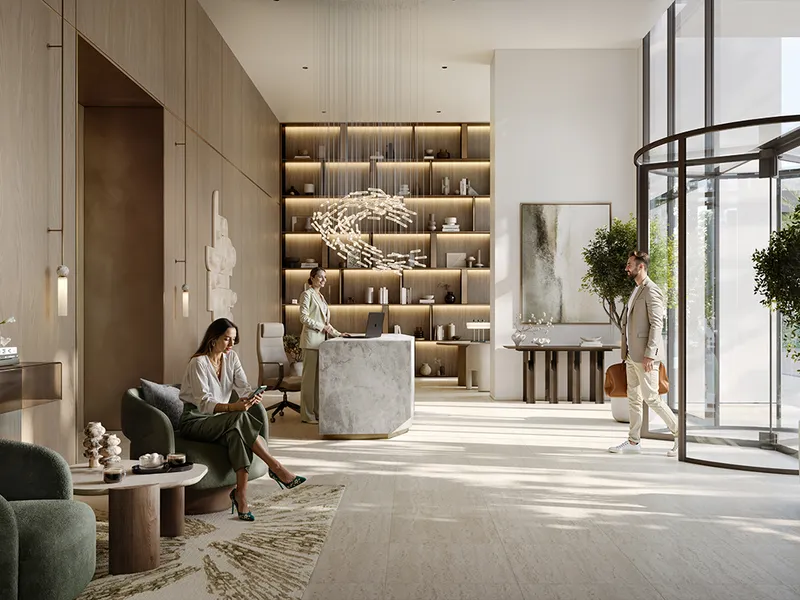 Interior render of the Creek Bay lobby with a stone reception desk, timber panelling and a revolving door