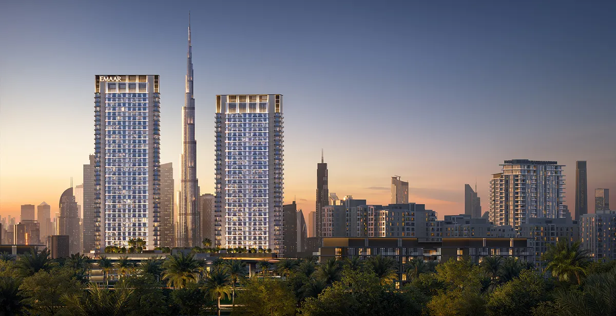 Render of the two Creek Haven towers at dusk with Burj Khalifa and the Downtown skyline behind