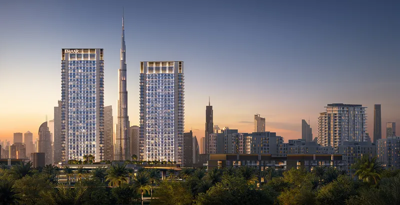 Render of the two Creek Haven towers at dusk with Burj Khalifa and the Downtown skyline behind
