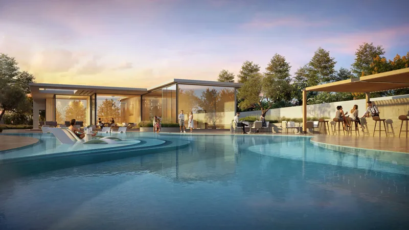 Community club pool with a pavilion and loungers at D-Villas