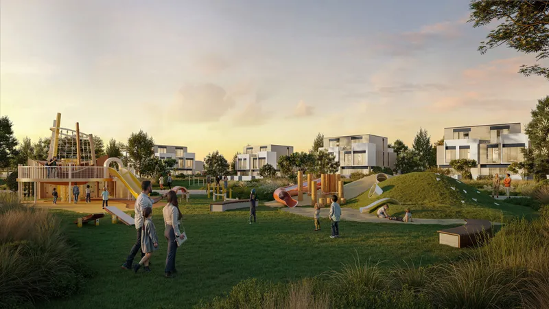 Linear park with a play area and lawns between D-Villas