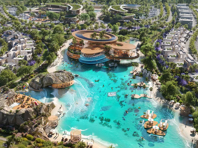 Aerial render of a lagoon with a floating restaurant, rock waterfall and townhouses at DAMAC Islands 2
