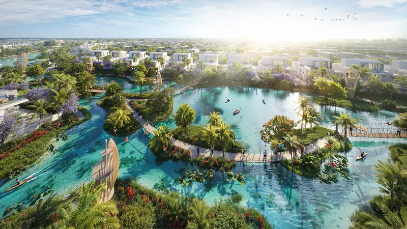 Render of the DAMAC Islands 2 lagoon with planted islands, footbridges and homes around the water
