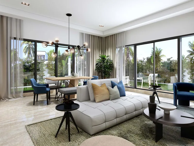 Living and dining room in a 5 bedroom DAMAC Riverside townhouse with full-height glazing onto the garden