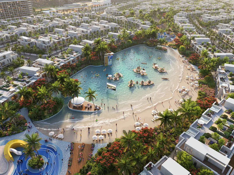 Aerial view of the Malibu Cove lagoon and beach surrounded by DAMAC Riverside townhouses