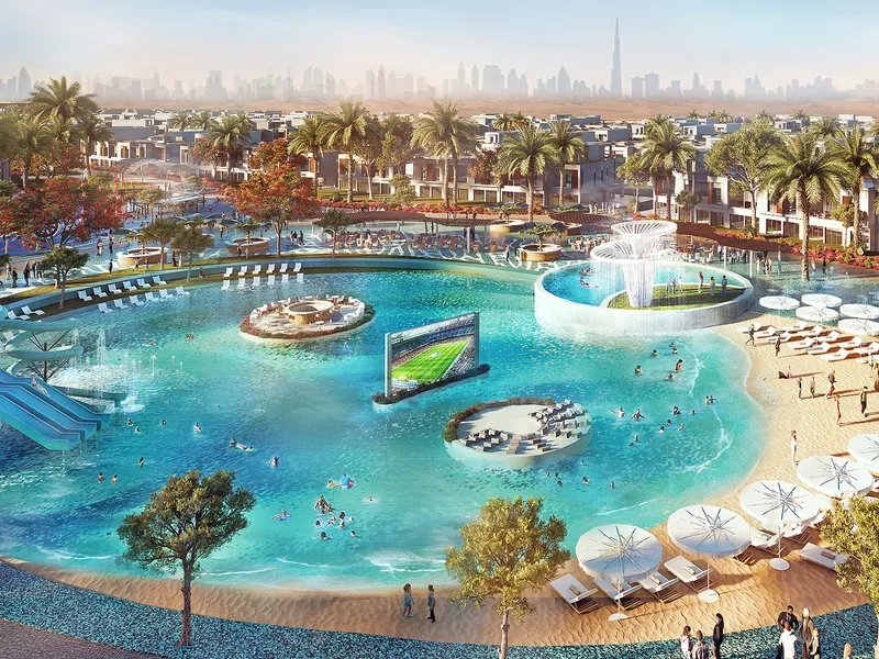 Malibu Cove lagoon with a sandy beach, fountain and floating screen at DAMAC Riverside