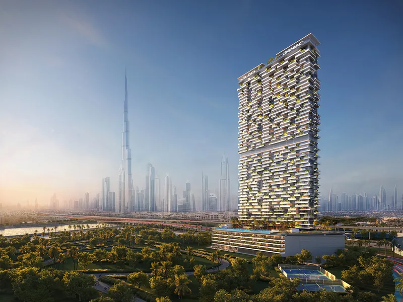 Safa Gate tower rising beside the trees of Safa Park, with Burj Khalifa and the Sheikh Zayed Road skyline behind