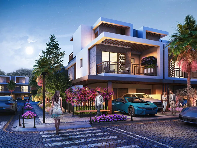 Violet 4 townhouses seen from a paved street in the evening, with parking at the front of each home