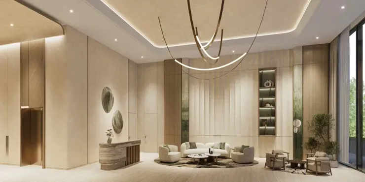 Double height residential lobby at Expo Valley Views in travertine and brass
