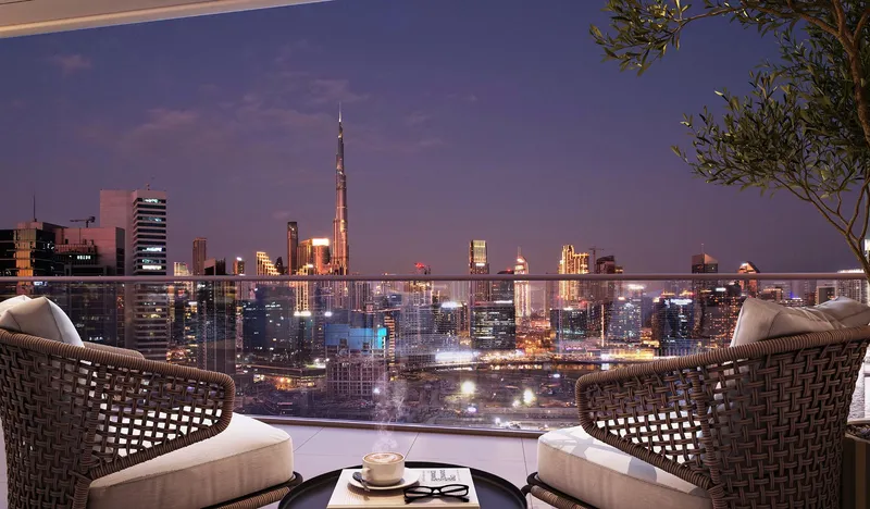 DG1 balcony at night looking over the Dubai Canal towards the Burj Khalifa