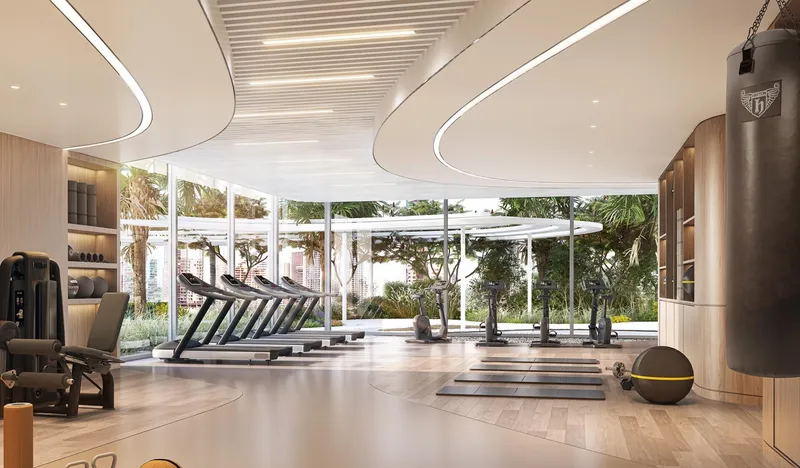 DG1 gym with treadmills and free weights beside full-height windows