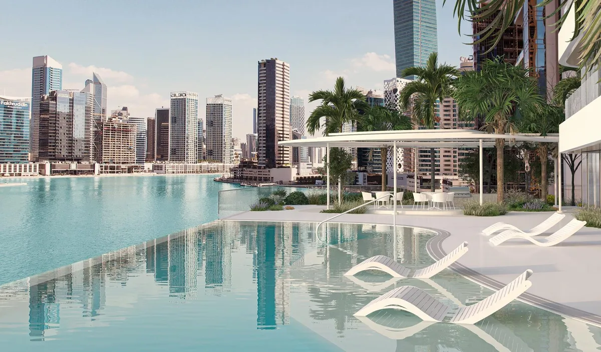 Infinity pool deck at DG1 overlooking the Dubai Canal and Business Bay towers