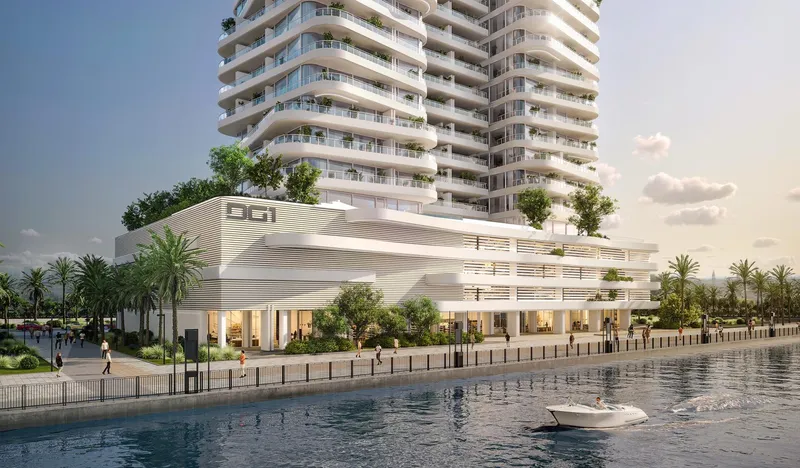 DG1 podium and lower floors on the Dubai Canal promenade, with a boat on the water