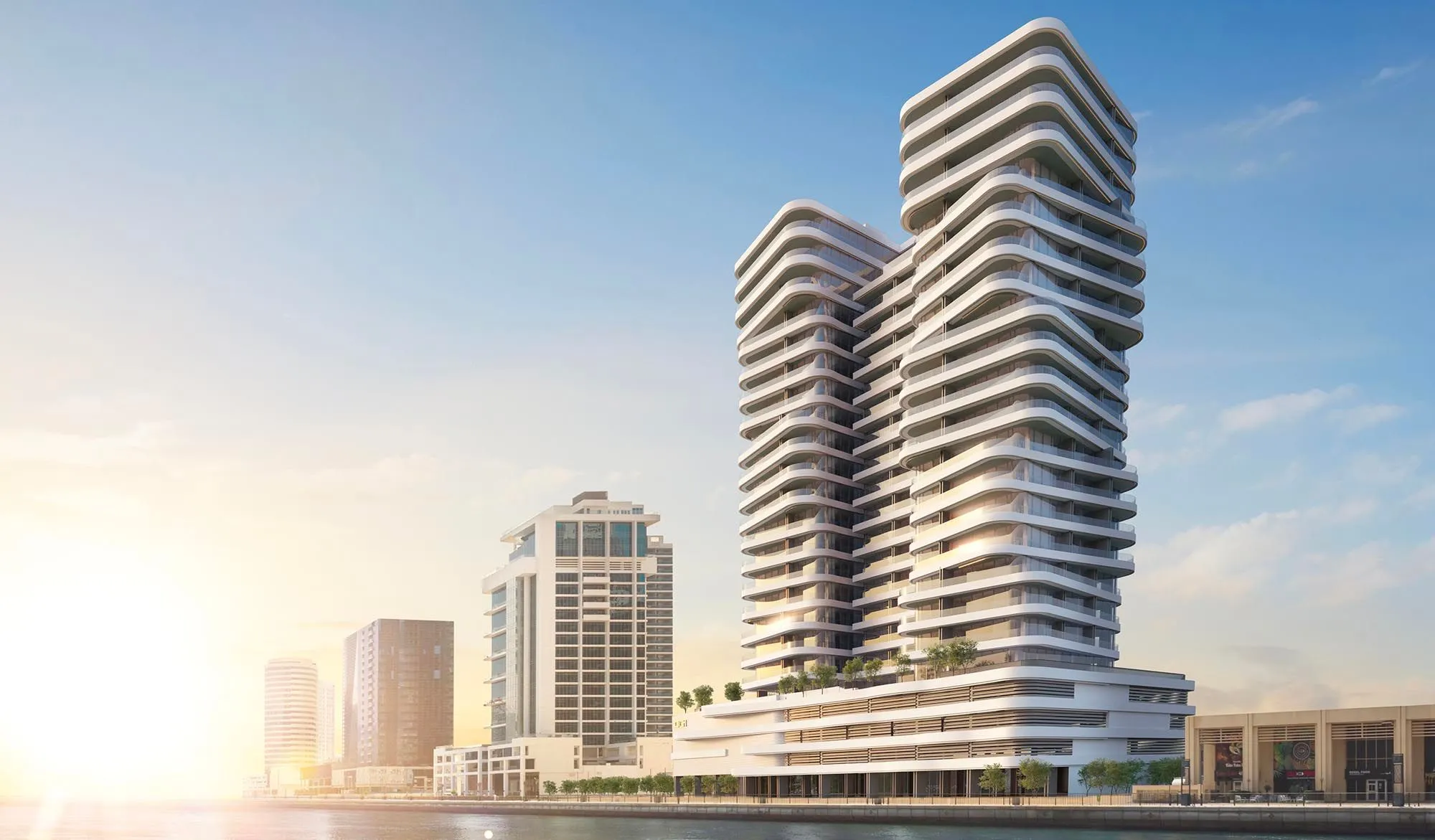 DG1 tower by DarGlobal with curved balconies rising beside the Dubai Canal in Business Bay