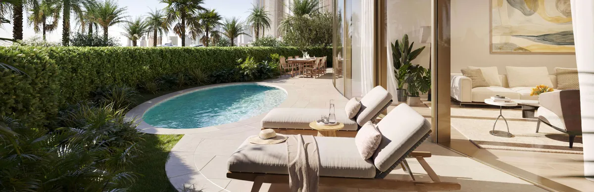 Render of a ground-floor residence garden with a curved plunge pool and sun loungers at The Residences at The Dubai Beach EDITION