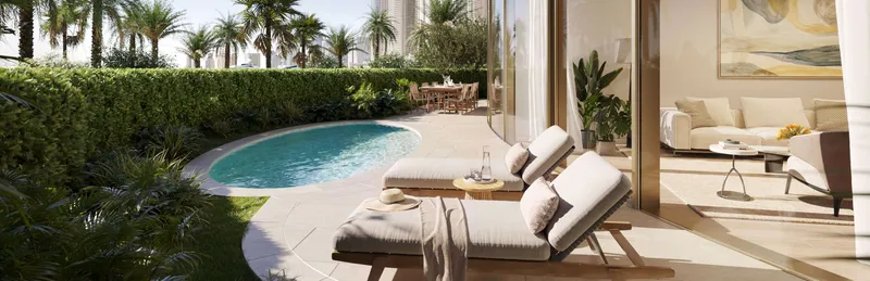 Render of a ground-floor residence garden with a curved plunge pool and sun loungers at The Residences at The Dubai Beach EDITION