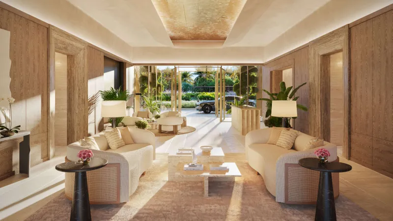 Render of a living room at The Residences at The Dubai Beach EDITION, with curved sofas and doors opening to a garden terrace