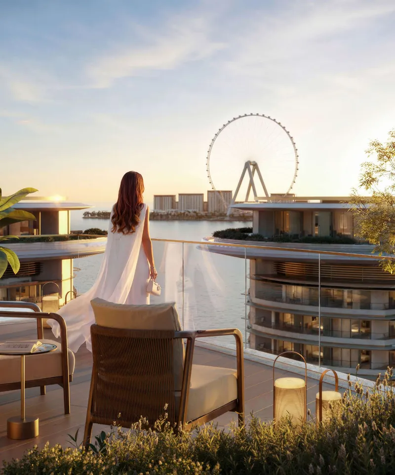 Render of a rooftop terrace at The Residences at The Dubai Beach EDITION at sunset, with the neighbouring tower and Ain Dubai beyond